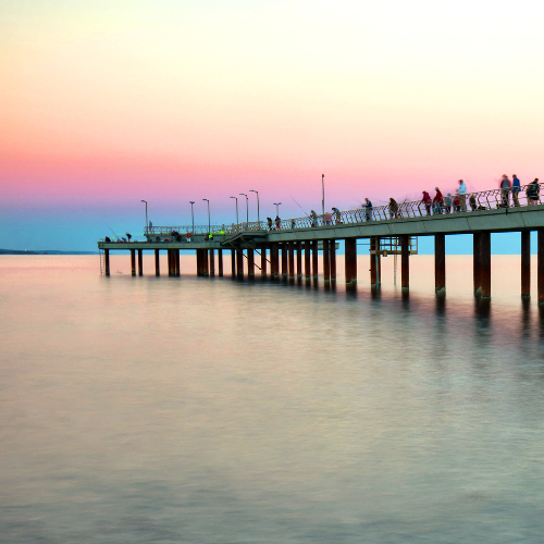 The famous landmark of Lorne Pier at sunset in Lorne, Viictoria, Australia