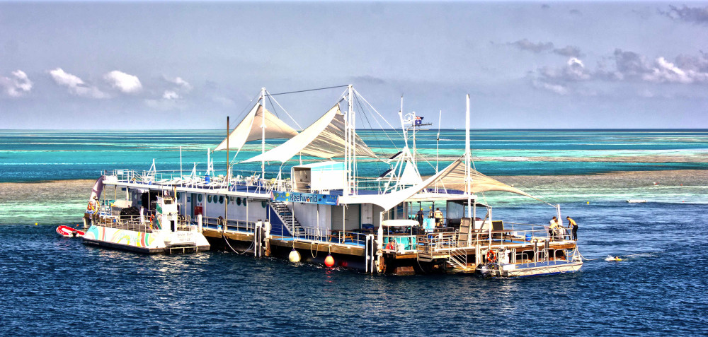 Great Barrier Reef Reefworld pontoon vsitors can snorkel, dive, ride a semi-submersible and stay overnight under the stars