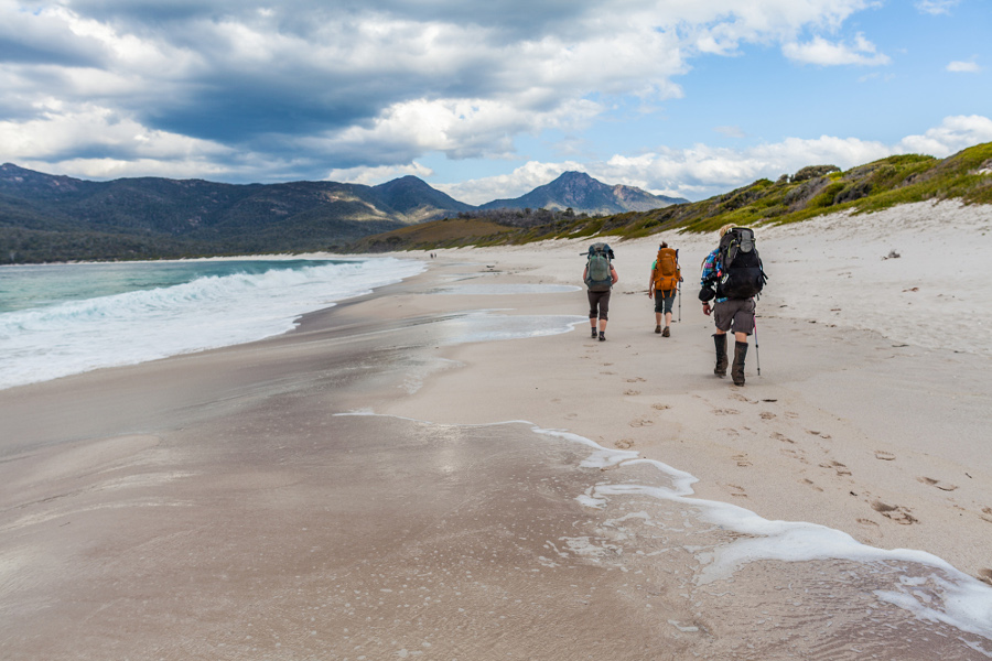 Bushwalkers along Hazards Beach, Peninsula-Circuit, Freycinet National Park, Australia @Dan Broun