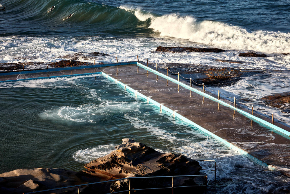 Dee Why rock pool Sydney fence and high tide, Australia